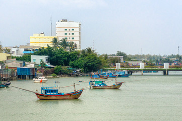 Naklejka na ściany i meble Traditional colorful fishing boats on the river Cai in Nha Trang, Vietnam