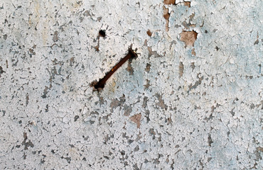 Old wooden background with remains of pieces of scraps of old paint on wood. Texture of an old tree, board with paint, vintage background peeling paint. old blue board with cracked paint,