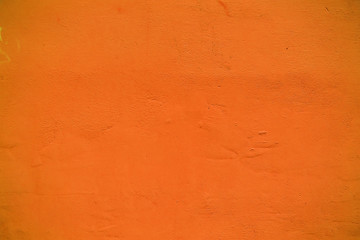 Orange grunge cement wall, textured background
