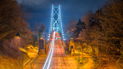 Vancouver, British Columbia. Canada View from above of the Lions Gate Bridge with lights trail,...