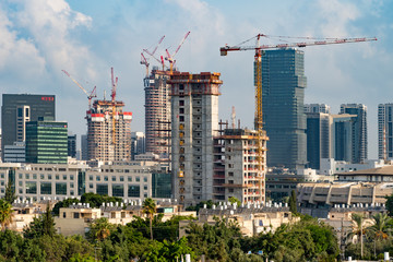 Tel Aviv's skyline high rise construction with cranes and water heaters, Israel	