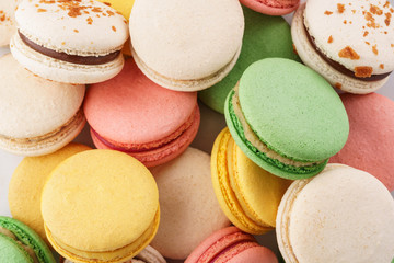 Fototapeta na wymiar Colorful french macarons background. Pastel colors. Overhead