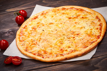 pizza on the wooden background
