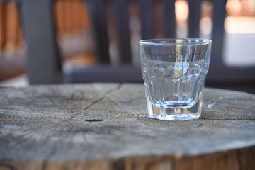 A glass on a tree trunk