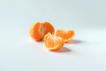 peeled mandarine slices or segments isolated