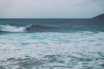 Naklejka na ściany i meble Retro vintage background image of ocean waves from the beach