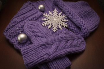  Knitted winter clothes are on the table. Large.