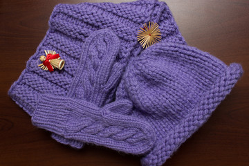  Knitted winter clothes are on the table. Large.