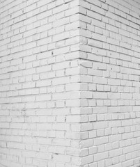 Brick wall painted with white paint.
