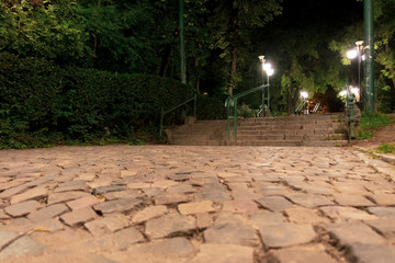 Cobblestone alley and stairs at the entrance of Cismigiu park