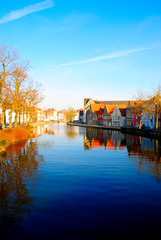 Fototapeta premium Houses near the canals of the river Reie in Bruges. Bruges is a wonderful, romatic city in Belgium, one of the Benelux countries in Europe.