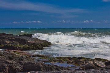 Fototapeta na wymiar Waves On The Beach Of A mediateranea Sea