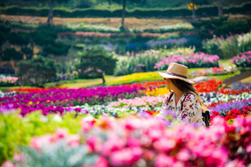 Girl looking beautiful garden, Chiang Rai, Tailand.