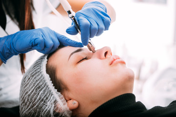 Naklejka premium Professional skin care, procedure Microdermabrasion of the facial skin at cosmetic clinic