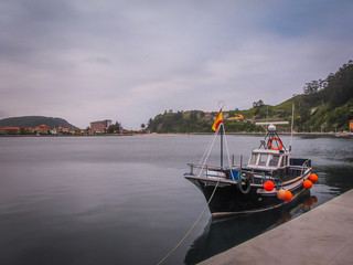 Fototapeta premium old fishing boat on the seaport