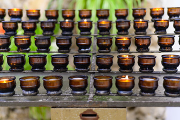 A series of prayer candles for believers and mourners