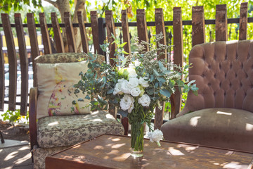 rustic wedding table setting with vintage couches and lounge chairs