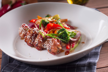 Chicken shish kebabs with green salad. Selective focus