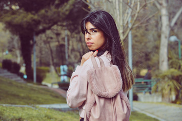 Attractive young woman enjoying her time outside in park