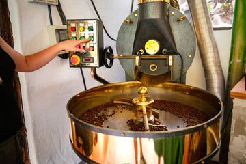Female Handles Roaster in Organic Coffee production