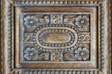 Vintage wood background with carving. Fragment of carved  door in Church, Greece.