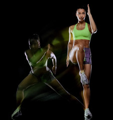 one mixed race woman exercising fitness exercises isolated on black background with lightpainting effect multiple exposures