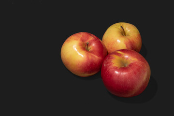 apples on black background