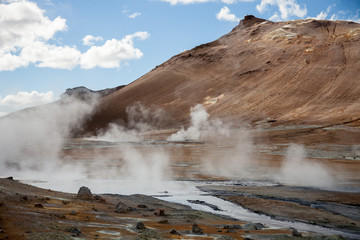Iceland geothermal zone Namafjall - area in field of Hverir. Landscape which pools of boiling mud and hot springs. Tourist and natural attractions.