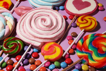 lollipop candies with jelly and sugar. colorful array of different childs sweets and treats on...