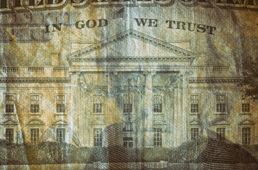 Close-up at In God We Trust & White House, highly magnified surface of used 20 dollars note with visible details of cotton fiber paper, with all flaws, watermarks and traces of usage.