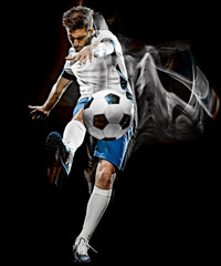 one caucasian soccer player man isolated on black background with light painting speed effect