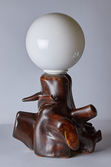 brown natural wood lamp with white canopy close-up, isolated on light background