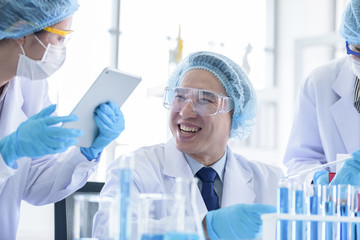 Asian senior scientist male researching and learning in a laboratory.