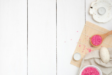 Rose bath salt and organic cosmetic on wooden table top view