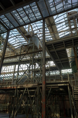 Obraz premium Industrial background, old abandoned factory hall with stairs and day light
