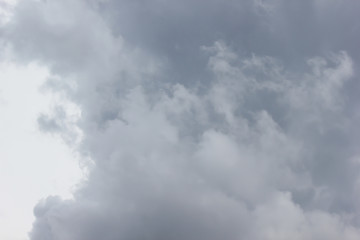 gray clouds in the summer blue sky