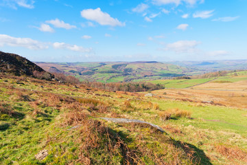 Fototapeta na wymiar Across the hills and dales of the Derbyshire Peak District on a bright spring morning.