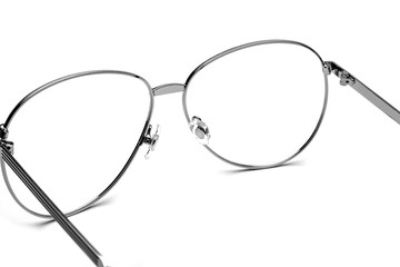Silver frame of flat glasses on white background