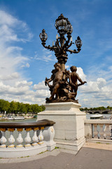 Fototapeta na wymiar Pont Alexandre III Bridge with sculptures and lantern