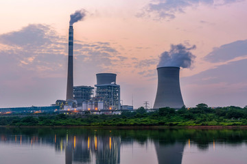 Fototapeta na wymiar At dusk, the thermal power plants , tops of cooling towers of atomic power plant