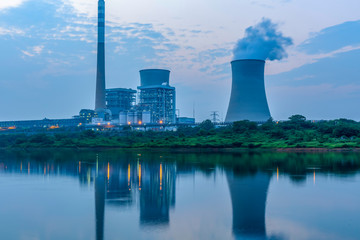 At dusk, the thermal power plants , tops of cooling towers of atomic power plant