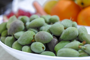 fresh fruit green almond ages in fruit plate