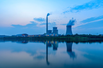 At dusk, the thermal power plants , tops of cooling towers of atomic power plant