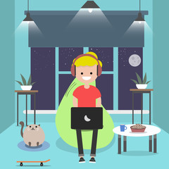 Young character sitting on bean bag with laptop.Night room.Gamer.Flat cartoon design