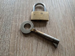 Lock and key close up. Big key and lock.