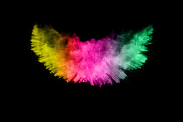 Abstract multi color powder explosion on black background.  Freeze motion of color dust  particles splash. Painted Holi in festival.