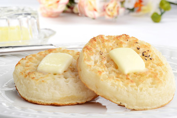 closeup english crumpets with melting butter