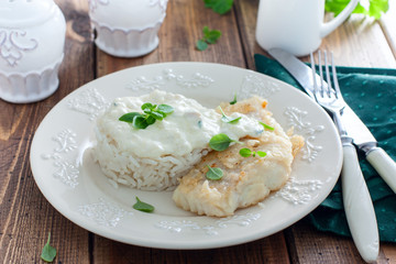 Fried cod, cooked with rice and cream sauce, horizontal