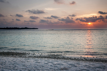 Colorful sunset on an island in the Maldives in the Indian Ocean