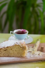 pieces of German butter cake with almonds on the wooden table